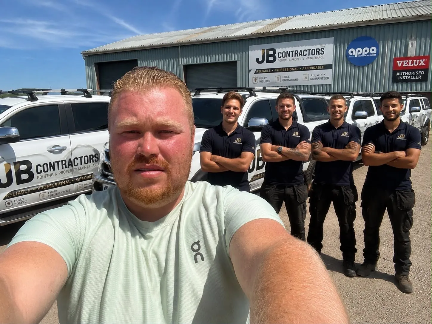 The Barnstaple Roofing team with their vans outside the yard
